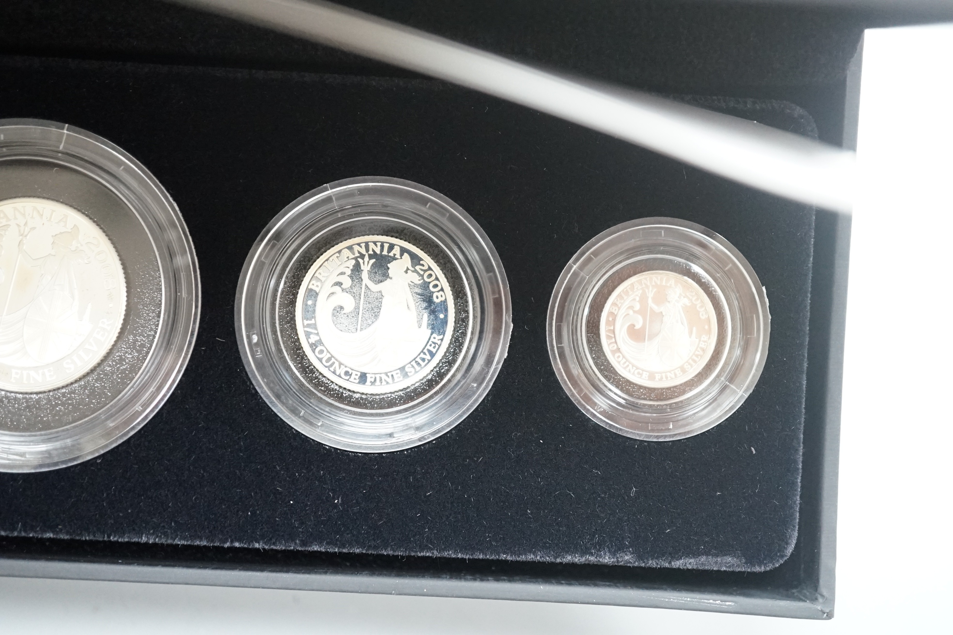 Two cased Royal Mint Britannia silver proof four coin sets, 2005 and 2008, 20p to £2
